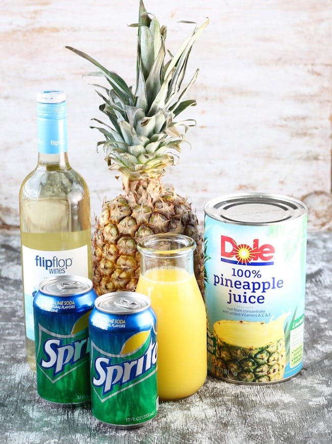 Ingredients for Easy Pineapple Wine Punch: Moscato Wine, Fresh whole Pineapple, Pineapple Juice, Orange juice and Sprite cans 