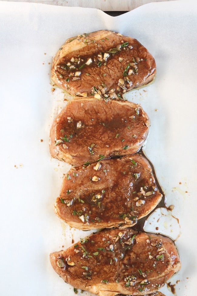 Balsamic Marinated Pork Chops on parchment paper