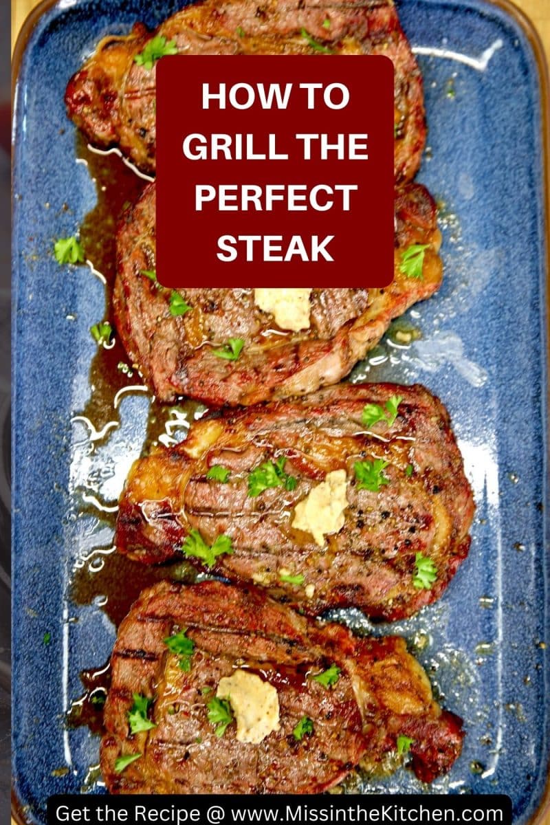 How to grill the perfect steak text overlay- 4 ribeyes with butter on a platter.