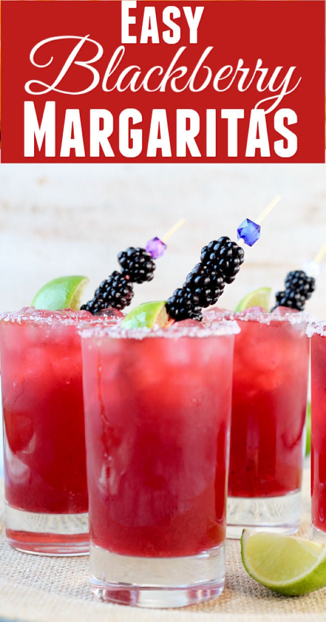 Easy Blackberry Margarita Party Cocktail garnished with fresh limes and blackberries