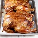 Smoked Whole Chickens on a tray