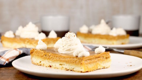 Pumpkin Pie Bars topped with whipped cream