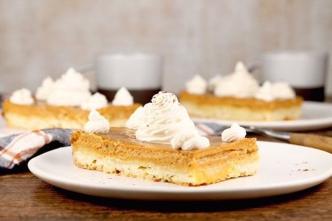 Pumpkin Pie Bars topped with whipped cream