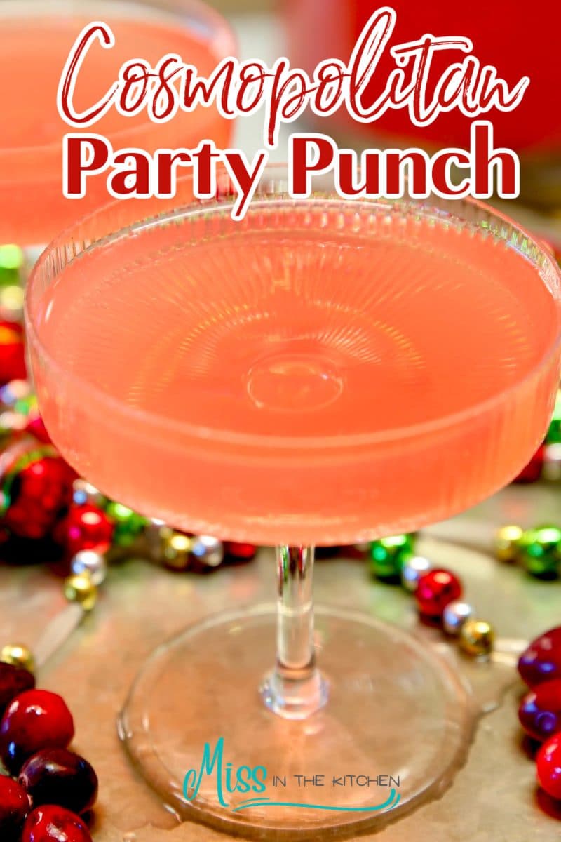 Cosmopolitan Party Punch in a coupe glass- text overlay.