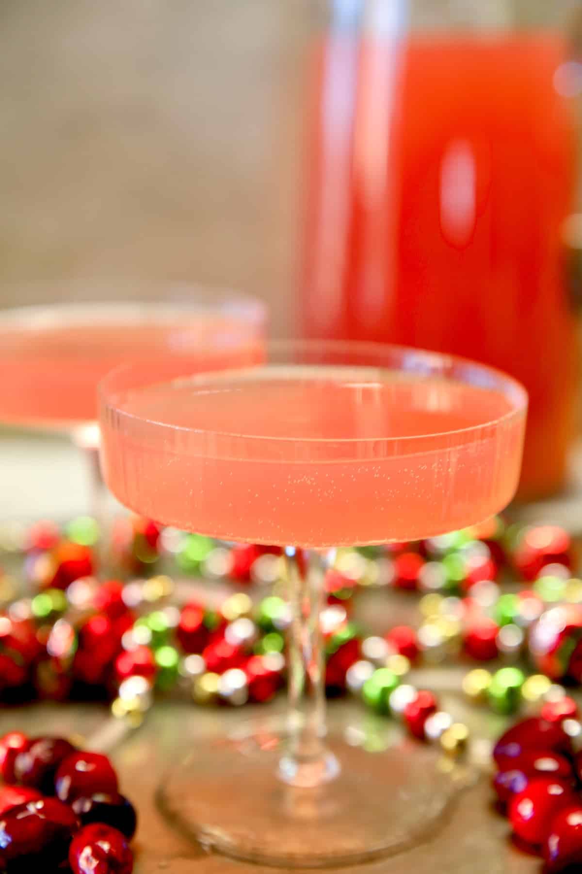 Cosmopolitan party punch in a coupe glass.