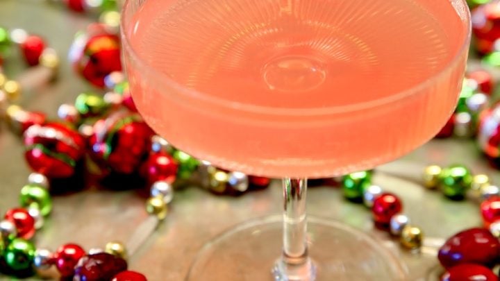 Closeup of cosmopolitan punch in a coupe glass.