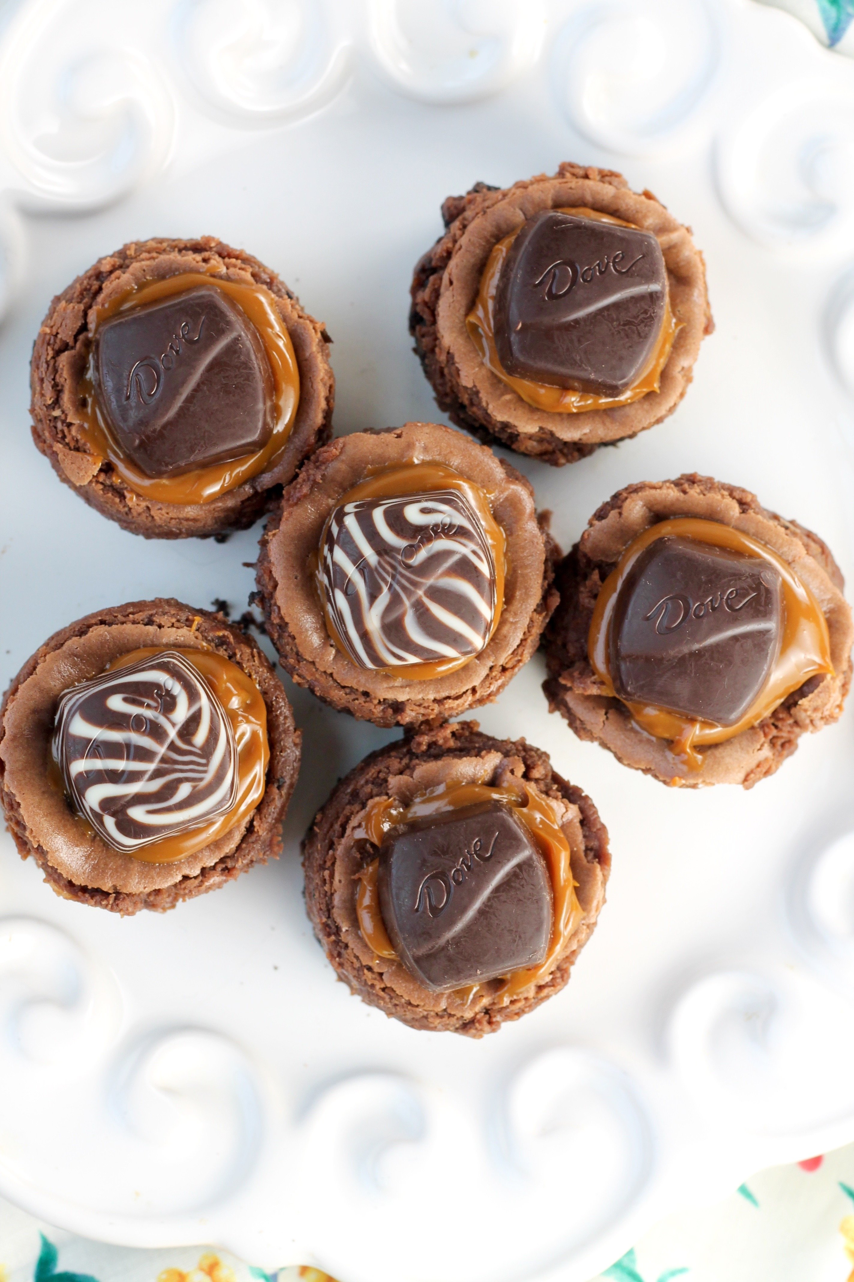 Mini Dove Cheesecakes with dulce de leche caramel and chocolate cheesecake