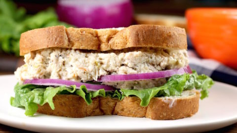 Turkey Salad Sandwich with lettuce and red onion on wheat bread