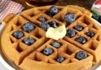 Easy Belgian Waffles topped with blueberries, butter and maple syrup