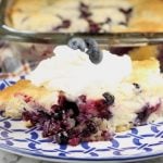 Easy Blueberry Cobbler served with sweetened whipped cream