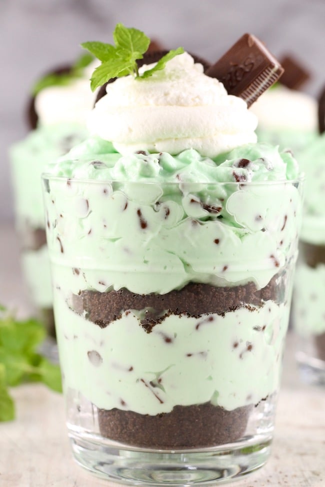 Mint Chocolate Chip No Bake Cheesecake garnished with Andes Mints and Oreo Cookies