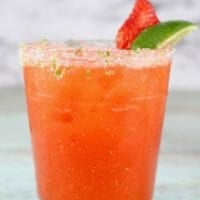 Strawberry Margarita garnished with salt & lime zest rim