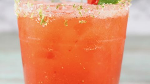 Strawberry Margarita garnished with salt & lime zest rim