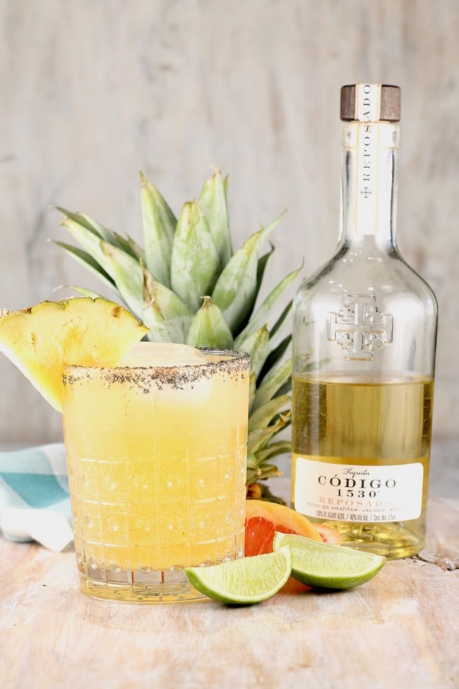 Codigo 1530 Reposado Tequila Pineapple Palmoa Cocktail garnished with fresh pineapple