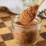 Spoon of Blackened Seasoning Mix in a jar