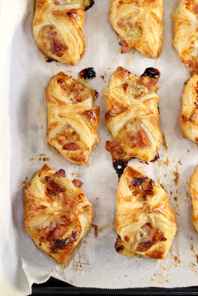 Baked Ham and Cheese Party Puffs on a parchment lined baking sheet