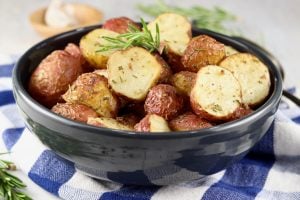 Roasted Red Potatoes with fresh rosemary garnish