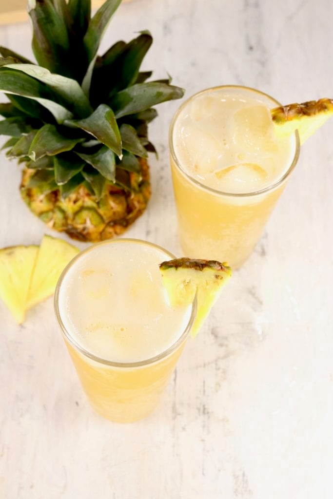 Glasses of Beer Punch garnished with fresh pineapple