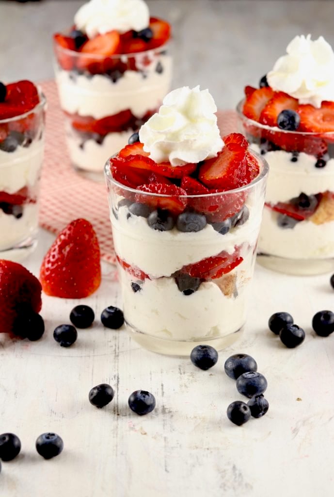 parfaits of angel food cake pieces, berries and cheesecake