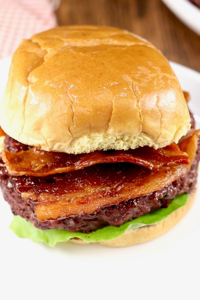grilled barbecue burger and topped with crispy bacon