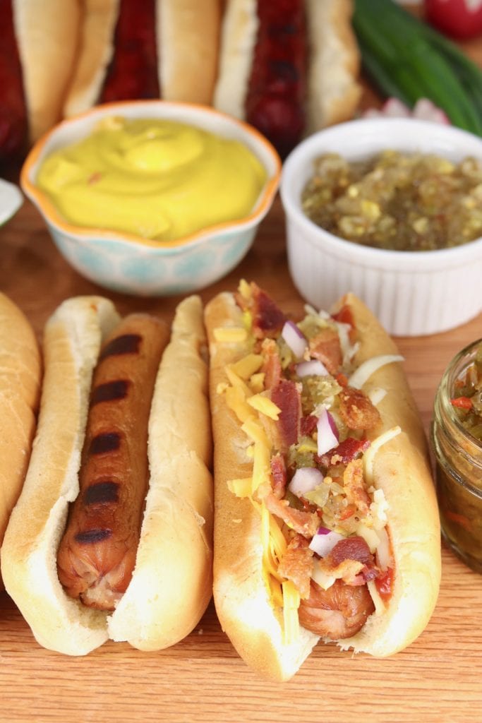 Grilled Hot Dogs with bowl of mustard and relish