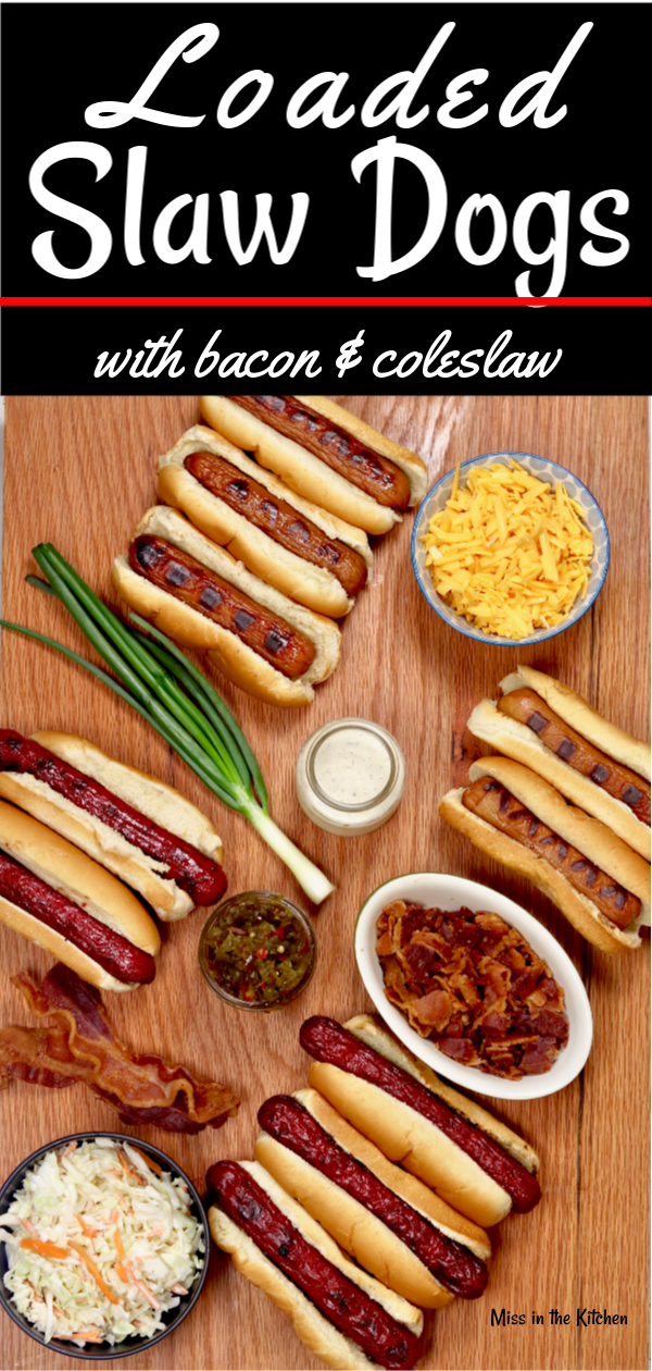 Loaded Slaw Dogs are a great addition to your summer cook out menus! Grilled hot dogs topped with smoked cheddar, bacon, creamy coleslaw and candied jalapeÃ±os 