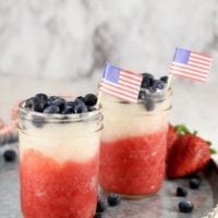 Red, White and Blue Daiquiris in mason jars with blueberries