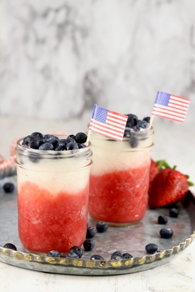 Red, White and Blue Daiquiris in mason jars with blueberries