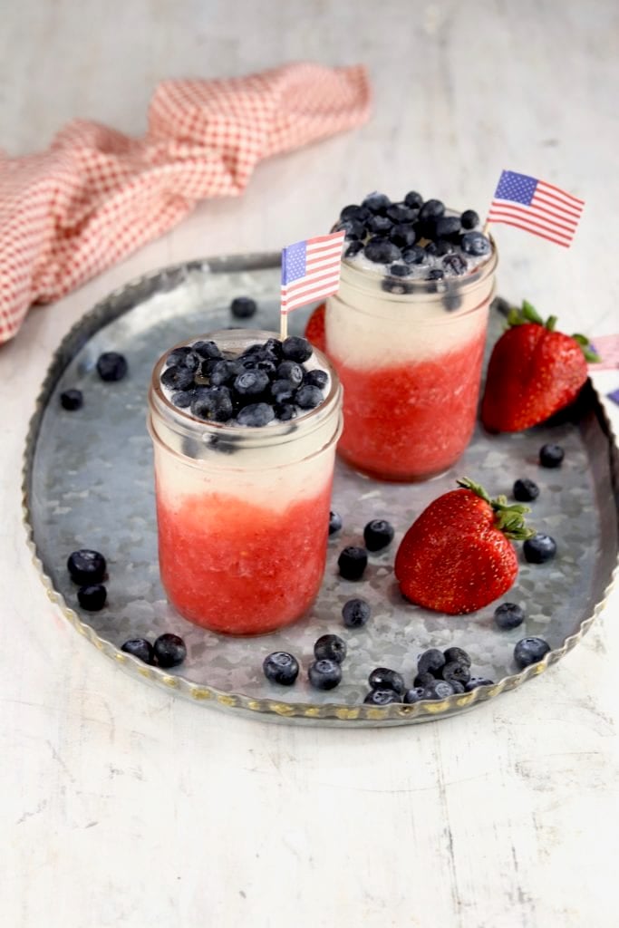 Mason Jars of Red, White and Blue Daiquiris with fresh blueberries