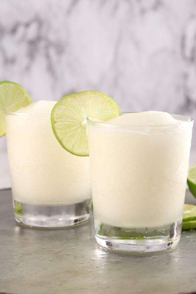 Frozen rum cocktail with fresh lime garnish