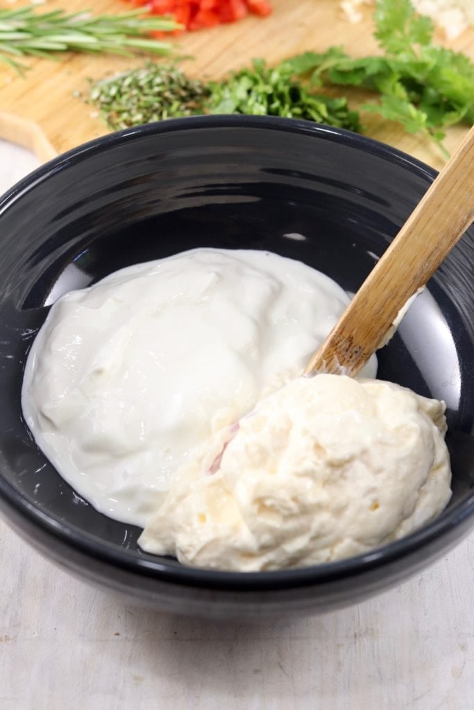 Mayo and sour cream in a black bowl for dip