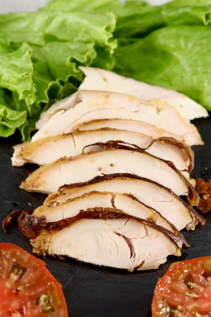 Sliced turkey breast with lettuce and sliced tomatoes