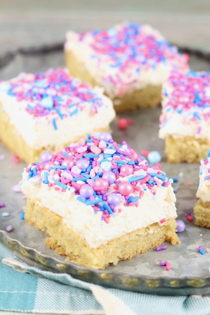 Galvanized tray of Sugar Cookie Bars with icing and sprinkles