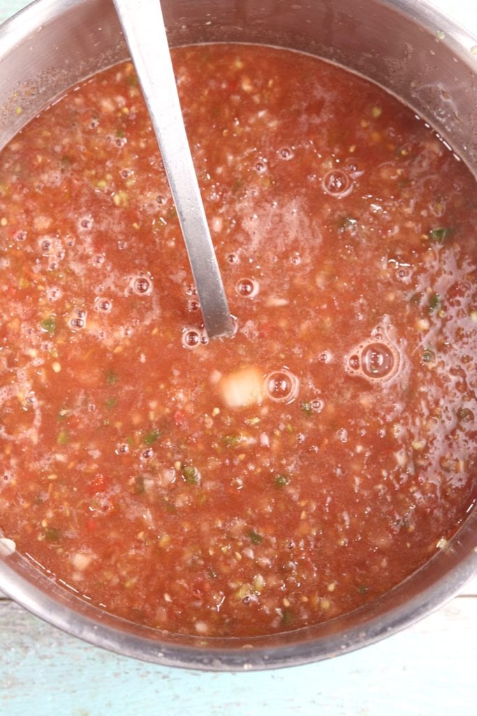 Dutch oven with processed tomatoes for salsa