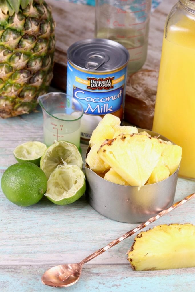 Ingredients for Pina Colada Mocktail with fresh pineapple, limes and coconut milk