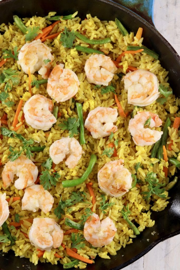 Overhead view of shrimp fried rice in a skillet