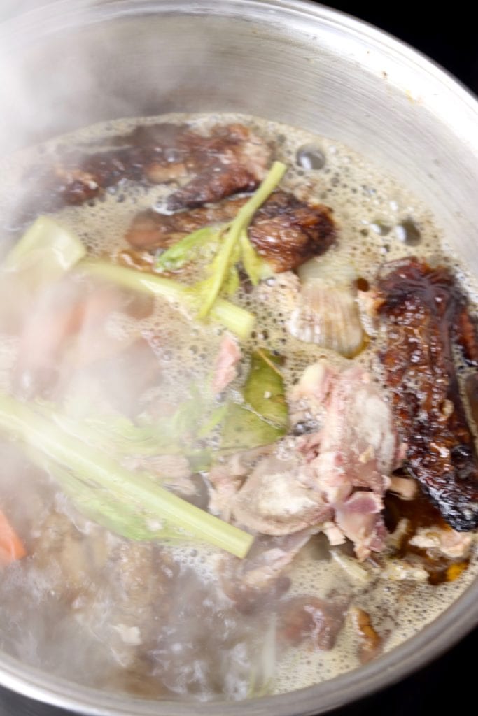 Boiling turkey bones and vegetables for broth