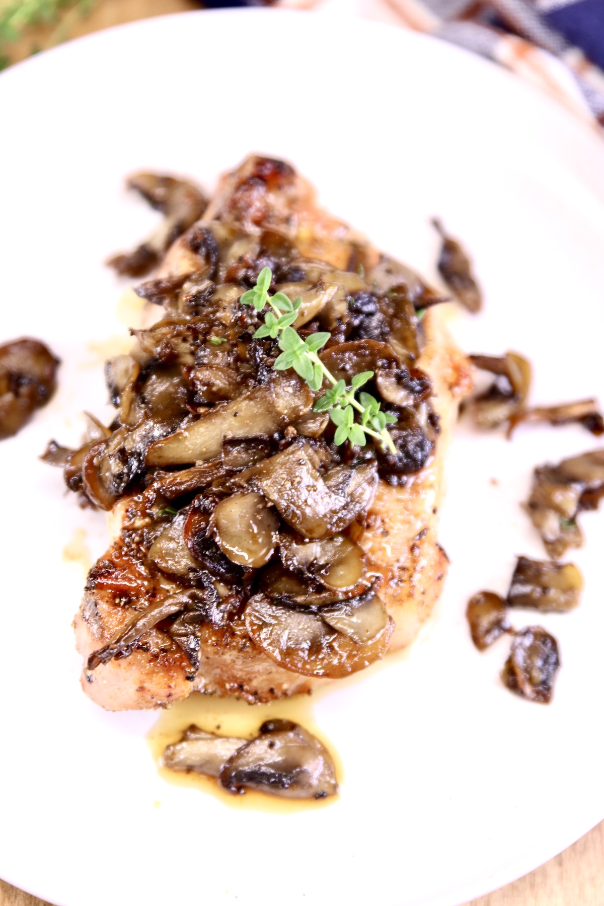Grilled Pork Chop topped with mushrooms