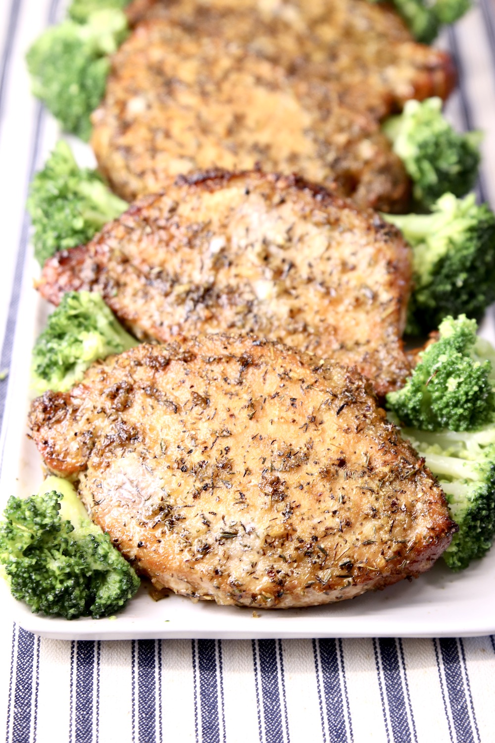 pork chops on a platter with broccoli