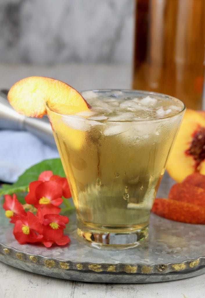 bourbon old fashioned cocktail with peach