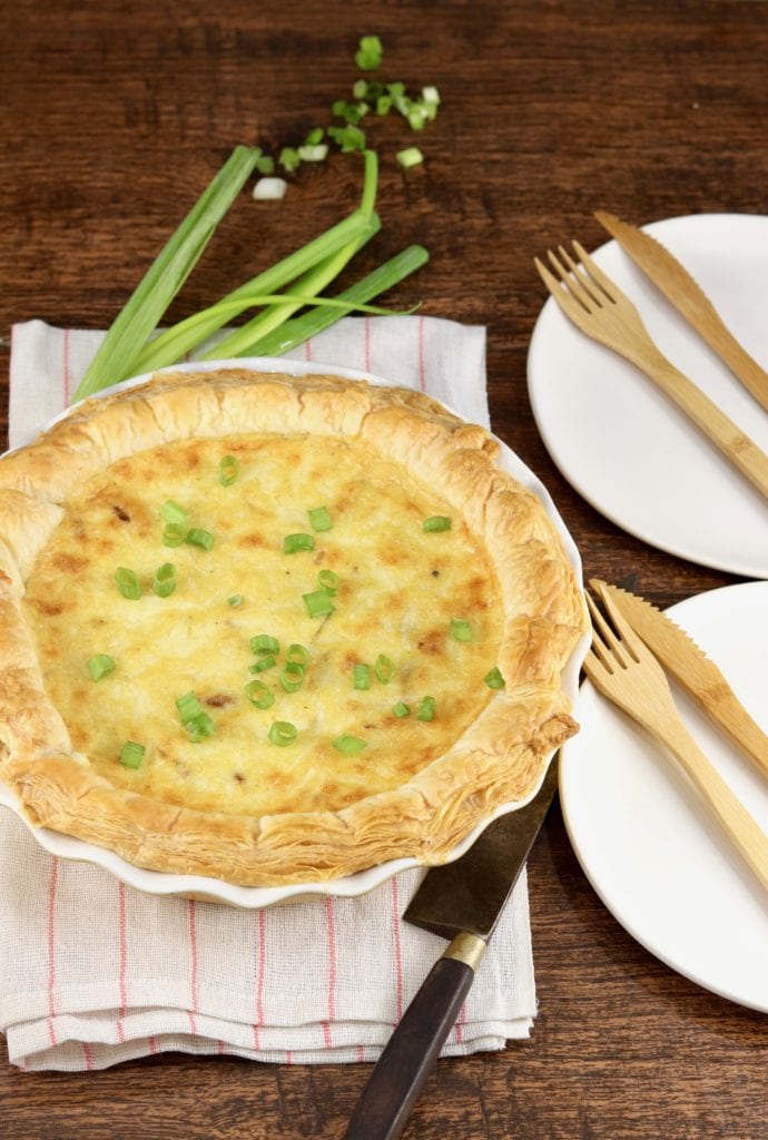 Baked quiche with green onions, bacon and cheese