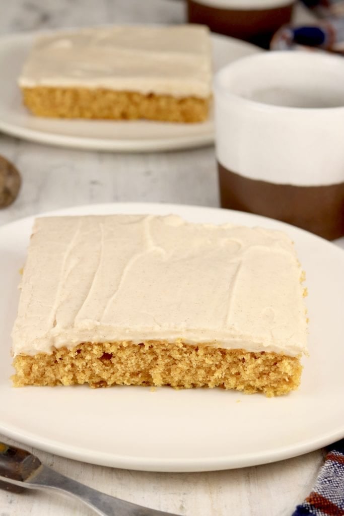 Slice of pumpkin cake with cream cheese icing