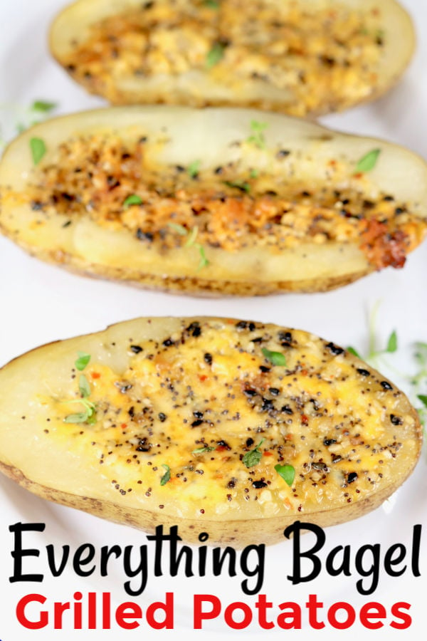 Overhead of baked potato halves with cheese and everything bagel seasonings