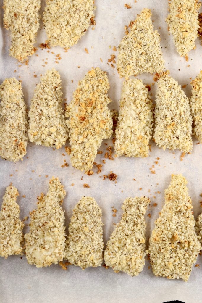 Baked Panko Breaded Fish Sticks on parchment paper lined baking sheet