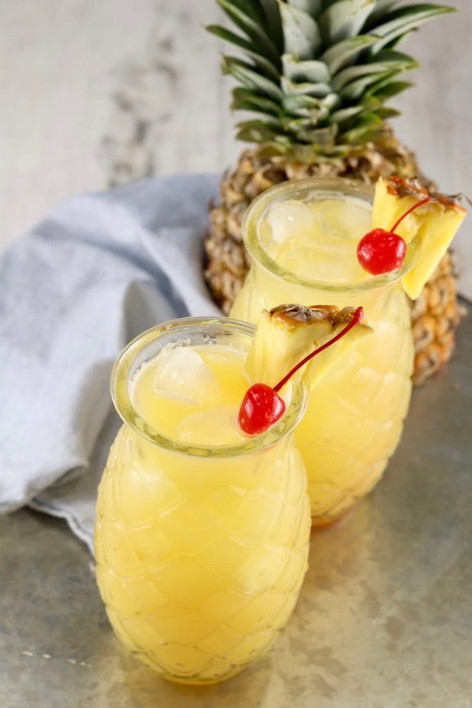 Fresh Pineapple with 2 pineapple glasses of peach and pineapple cocktail