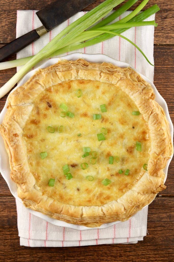 Quiche garnished with green onions