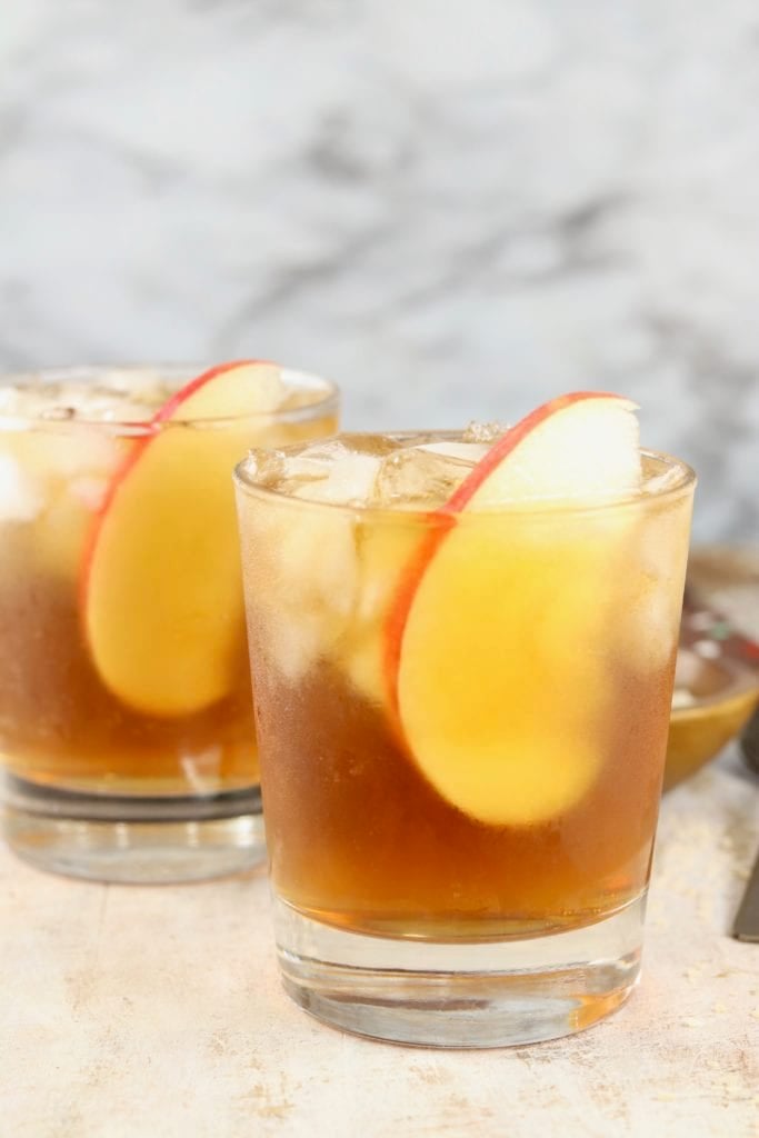 Apple Cider Cocktail with black rum and apple slice garnish