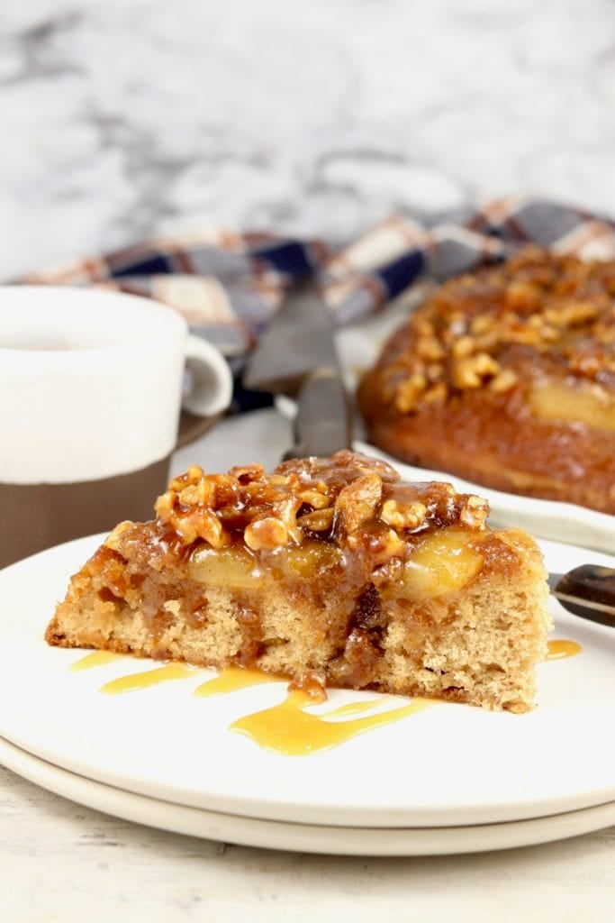 Slice of Caramel Apple Upside Down Cake with walnuts