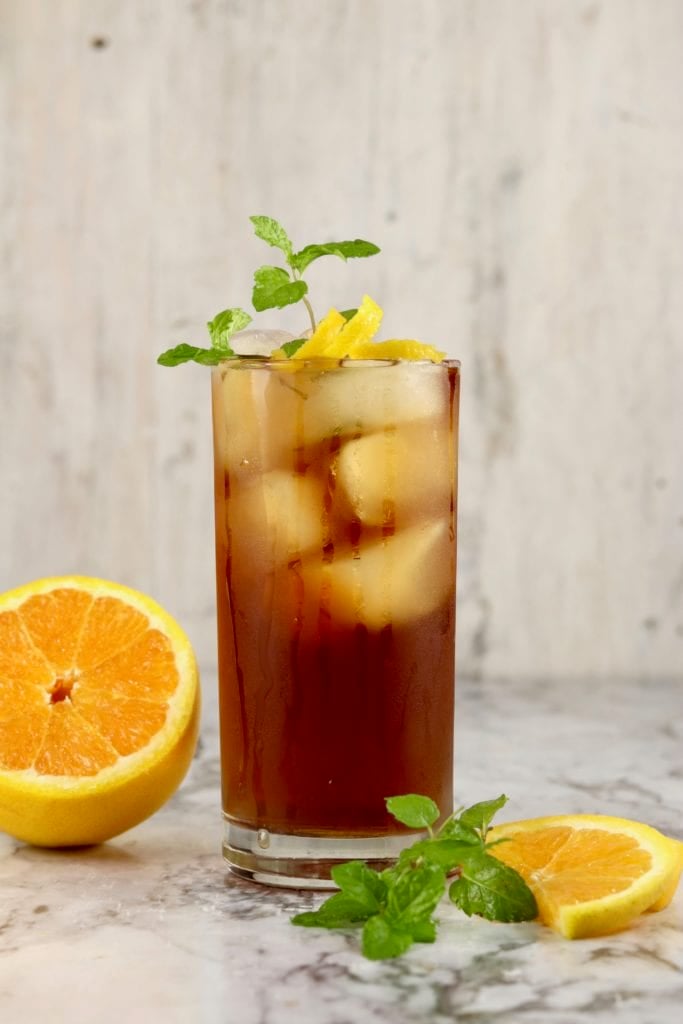 Backyard Sweet Tea Cocktail with orange and mint garnish