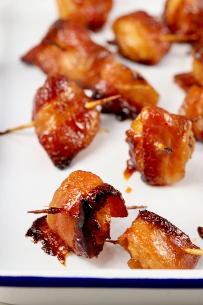 Bacon Wrapped Water Chestnuts appetizer on white tray
